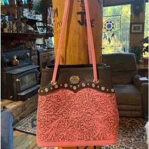 Montana Silversmith Leather purse. Pink tooled leather with brown leather trim.